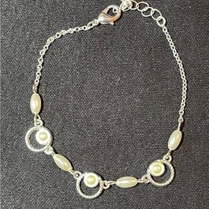 105 - 7” silver tone bracelet